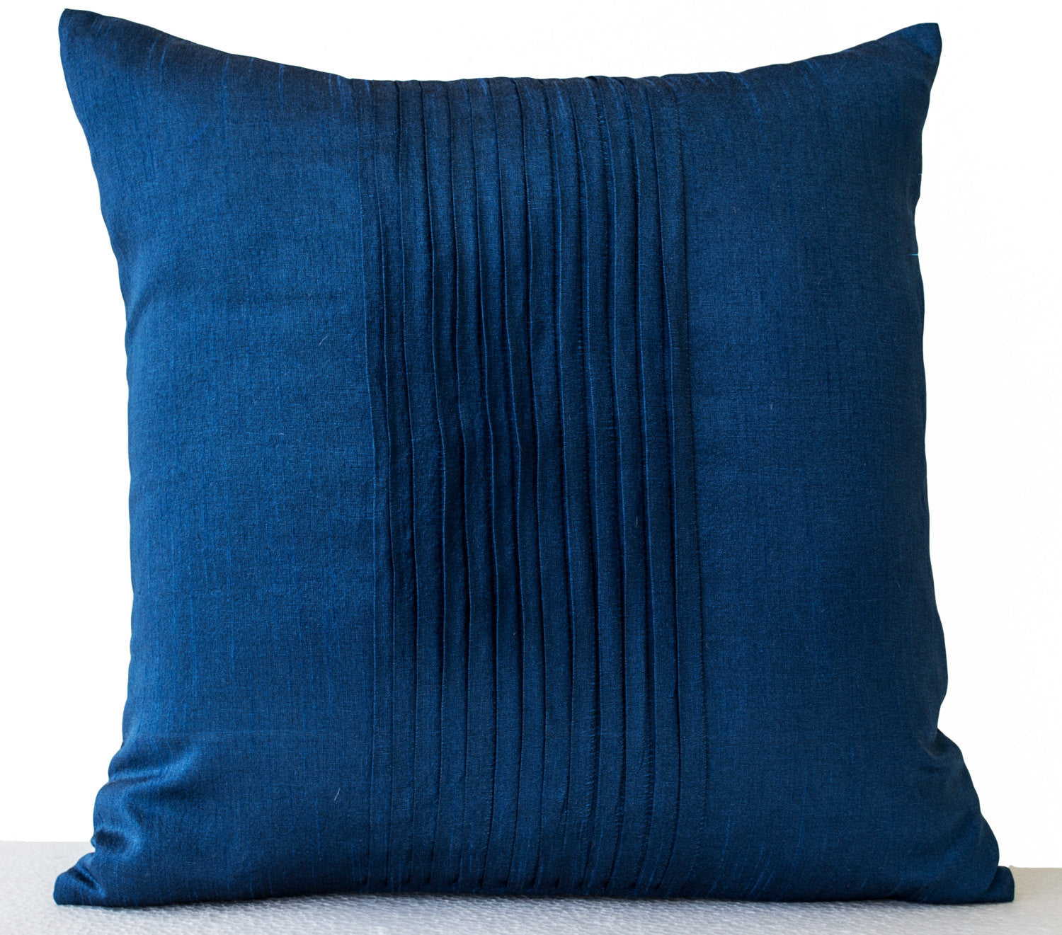 Handmade dark blue silk throw pillow with rippled pin tuck pattern