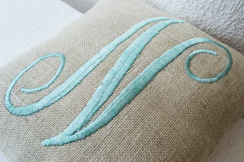 Handmade ivory throw pillow with mint embroidery and monogram