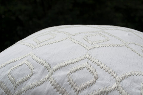 Handmade white silk cushion cover with ikat embroidery