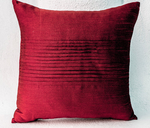 Handmade red silk throw pillow with rippled pin tuck pattern