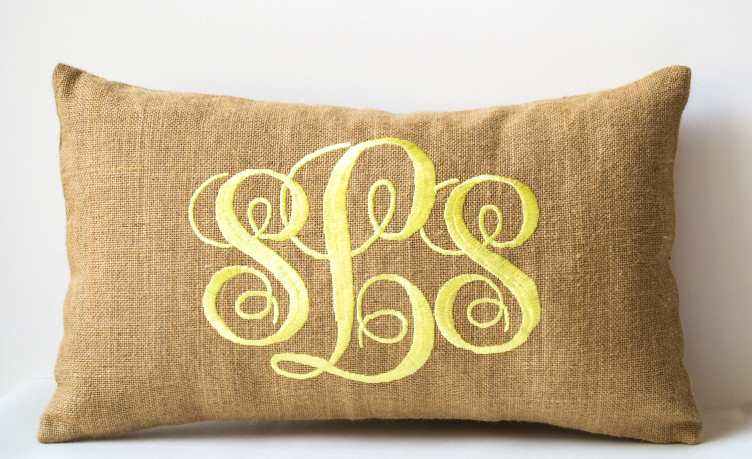 Handmade pillows with cursive design and monogram