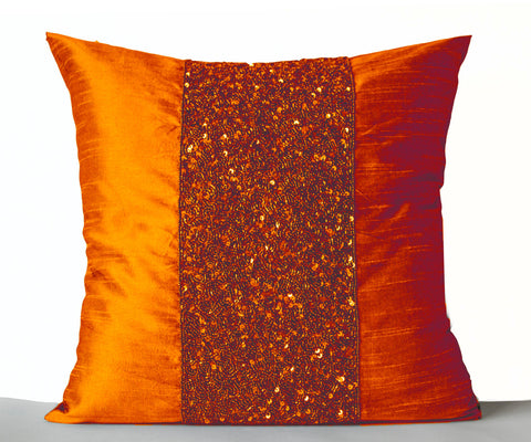 Handmade orange silk throw pillows with beads and sequin