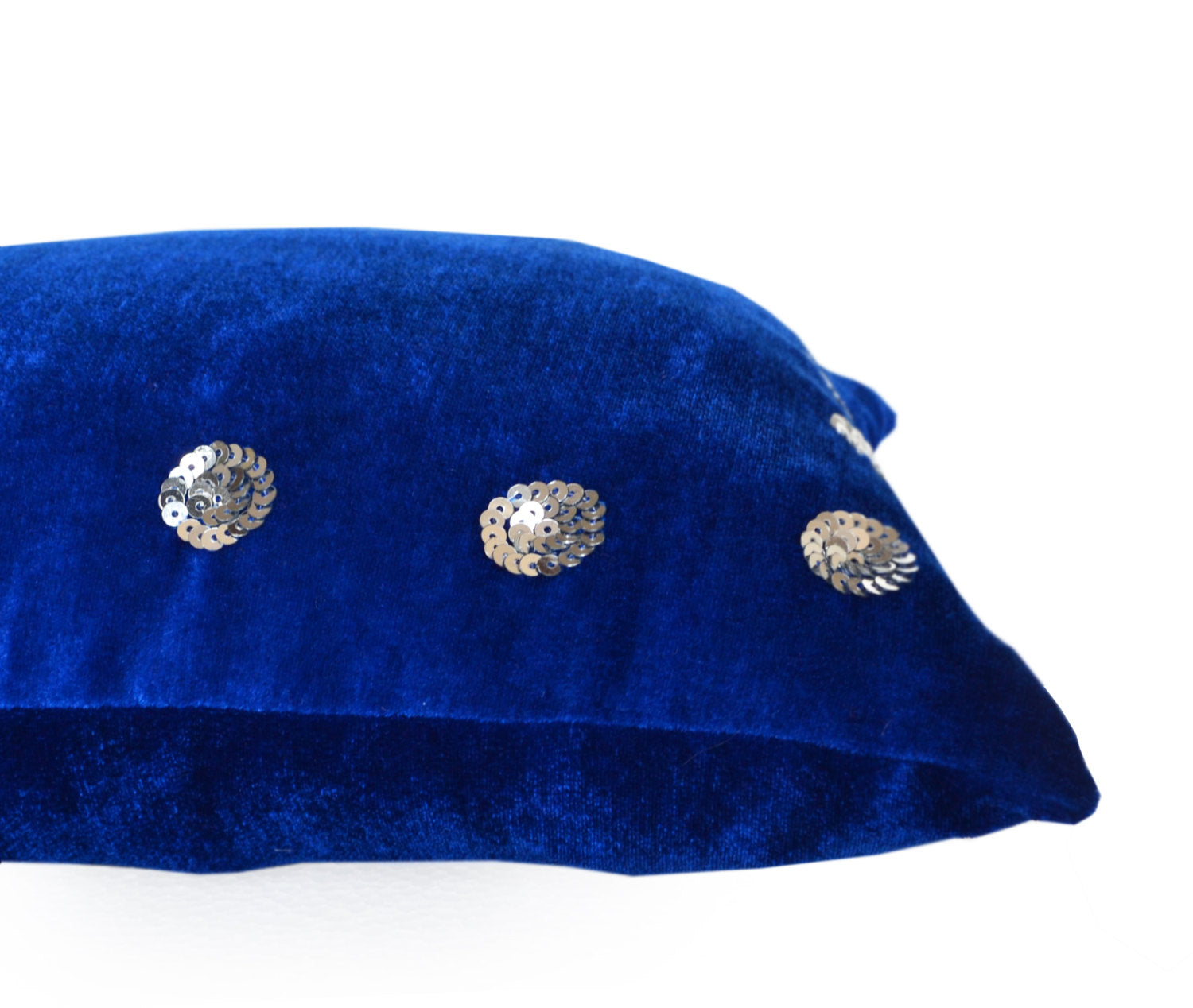 Amore Beaute Royal blue pillow in velvet with silver sequin detail.