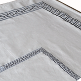White table cloths and table linens with Greek key embroidery